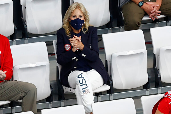 Jill Biden wore pieces from the U.S. Olympics uniform by Ralph Lauren to watch the men’s 400-meter individual medley swim race in Tokyo.